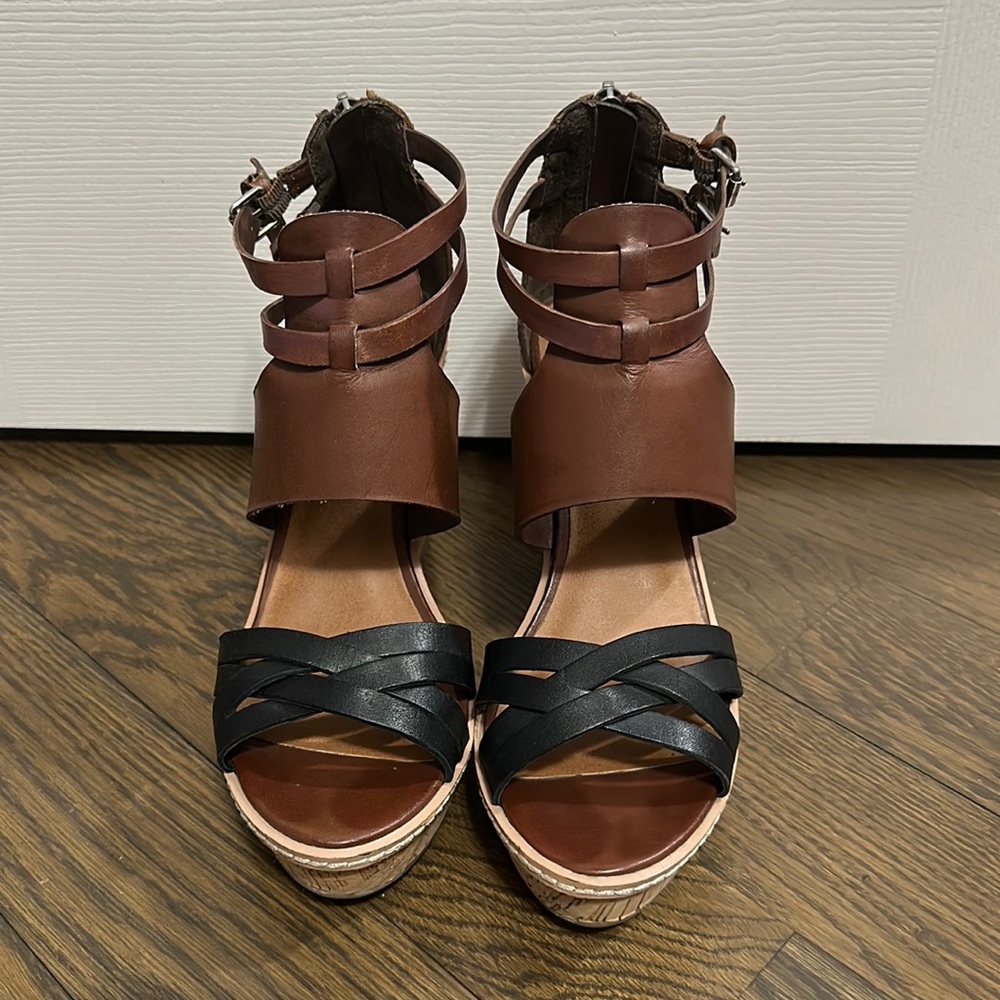 Used DV by Dolce Vita black and brown wedges. Size 8.